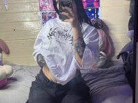 Brunette teen takes selfies while stripping to her thong on a bed - Photo #1