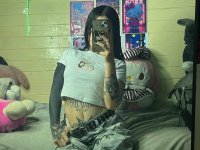 Brunette teen takes selfies while stripping to her thong on a bed - Photo #2