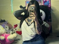 Brunette teen takes selfies while stripping to her thong on a bed - Photo #20