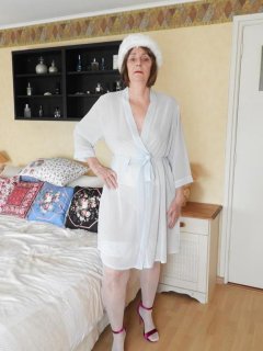Hot granny Kat Kitty in sheer white lingerie toying her wet pussy with dildo