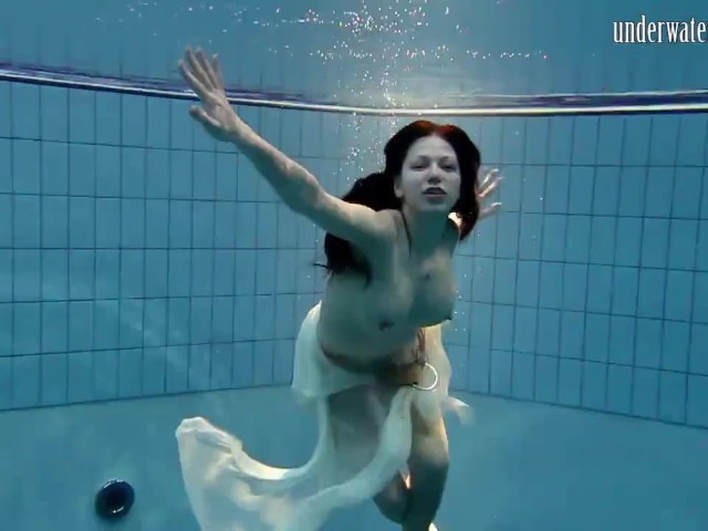 Dark haired teen Andrea in the pool